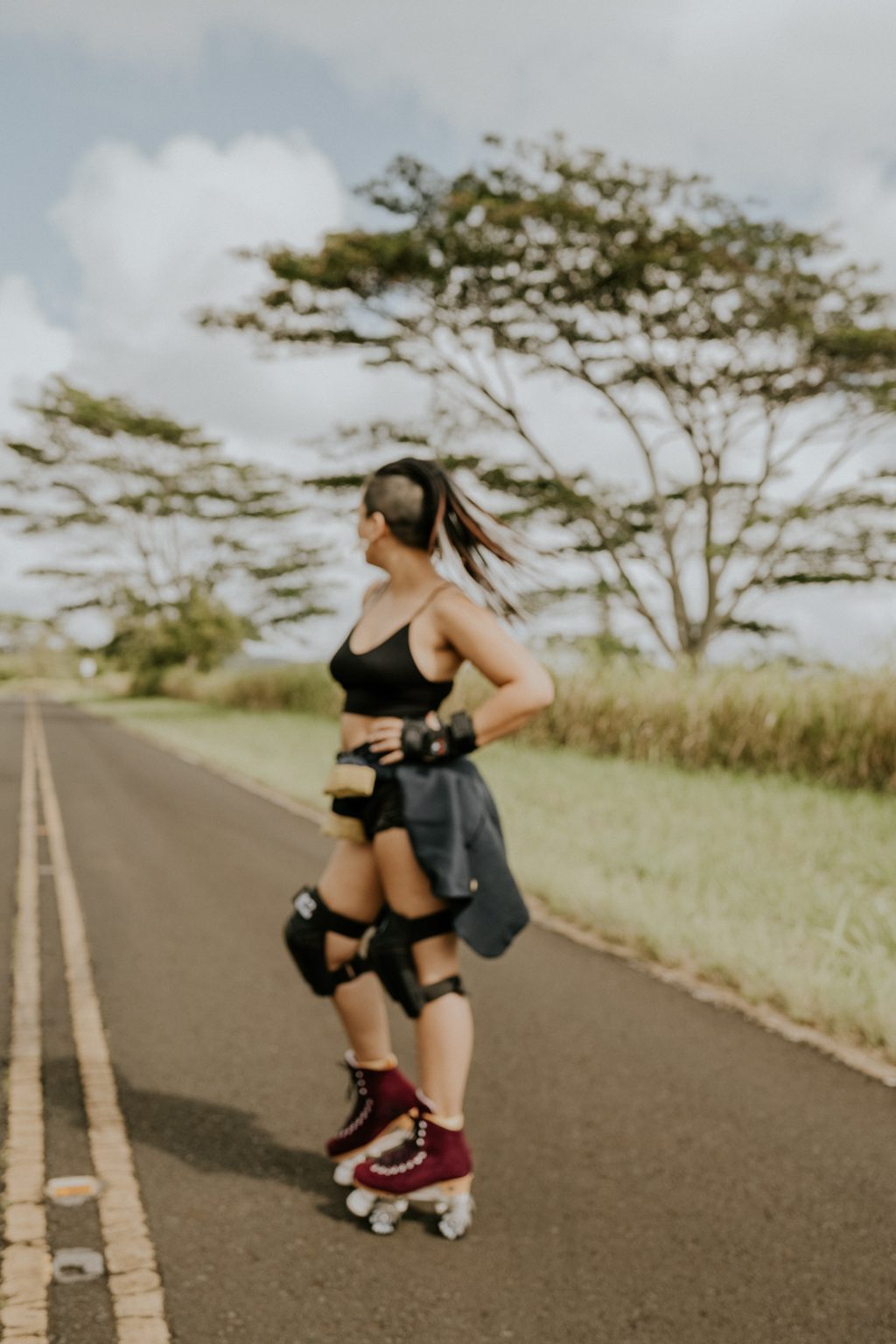 Image of Shaina hiking the cliffs at Shipwrecks Beach, Kauai