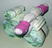 Schritt für Schritt Bastelanleitung um aus Pampers Windelfiguren, Windeltorten, Windelmotorrad, Windelburgen und vieles mehr selbst zu basteln oder Windeltorten online zu bestellen