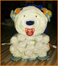 Windelbär Bastelanleitung, Anleitung - Wie kann ich einen Bären aus Pampers / Windeln selber basteln sowie viele weitere Anleitungen für verschiedene Windelmotive und Figuren aus Windeln